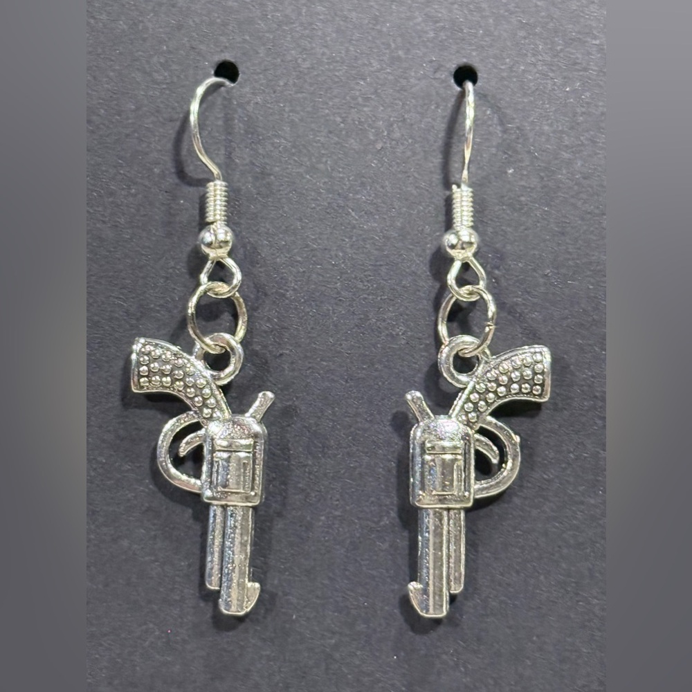 Silver Revolver Earrings with Intricate Design
